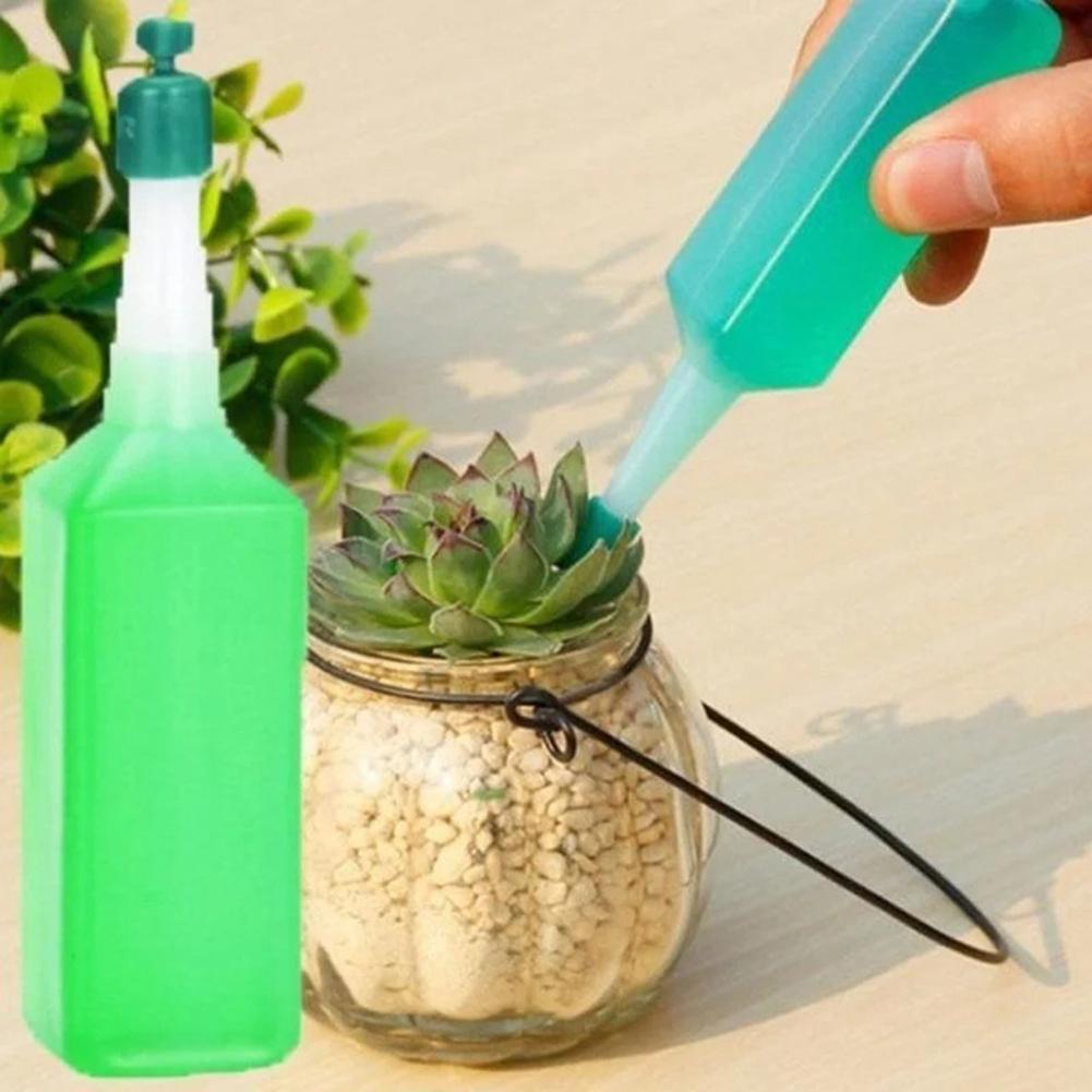 Eco-Friendly Plant Watering Device with Water-Saving Green Bottle